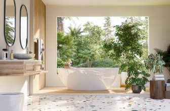 Salle de bain de luxe lumineuse ouverte sur la végétation